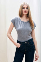 Female model wearing Jumper 1234 cap sleeve mid grey cashmere crew neck jumper with ribbon tie detail at the back