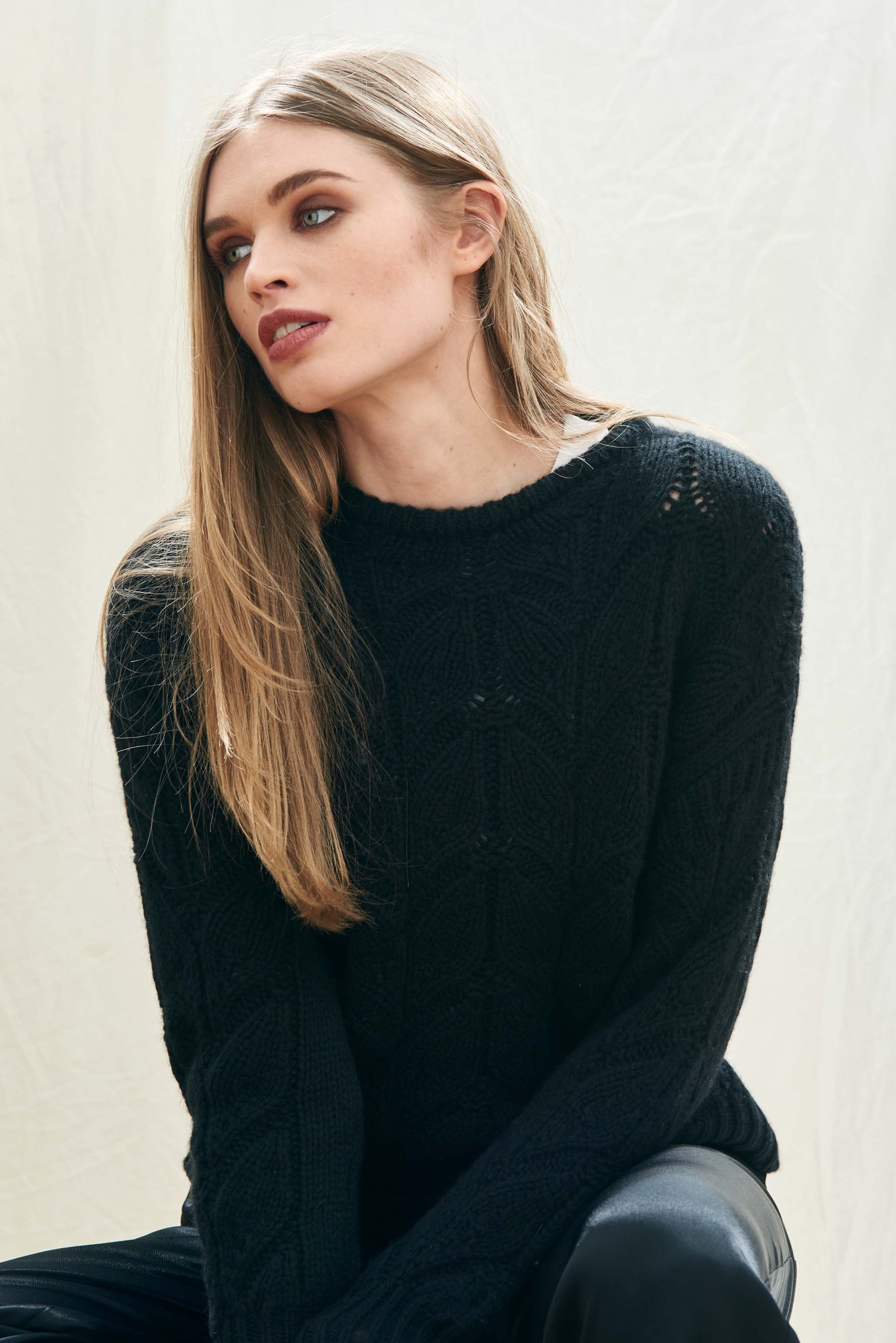 Female model wearing Jumper1234 black heavy weight 'leaf' textured crew neck jumper in cashmere wool