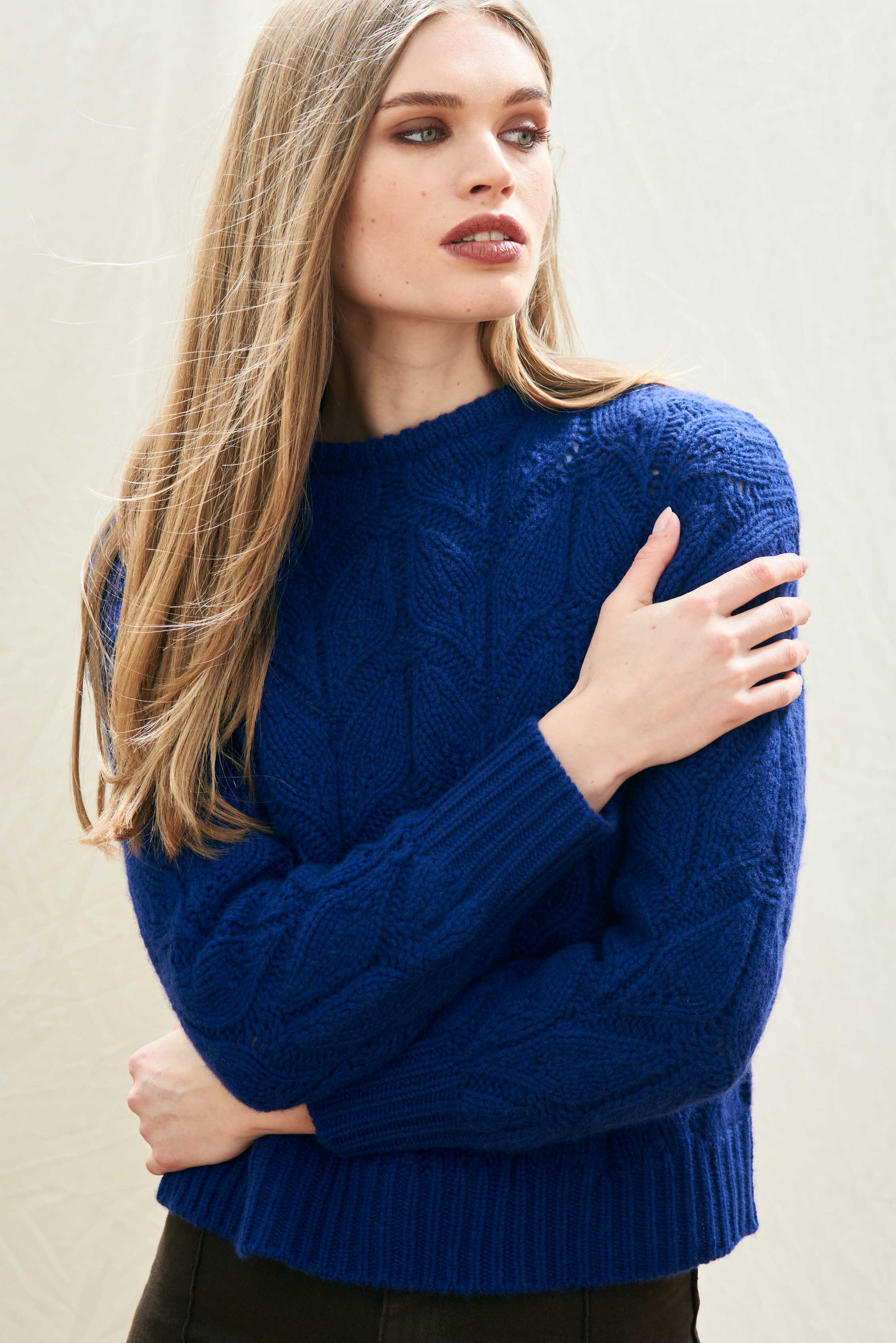 Female model wearing Jumper1234 bright blue heavy weight 'leaf' textured crew neck jumper in cashmere wool