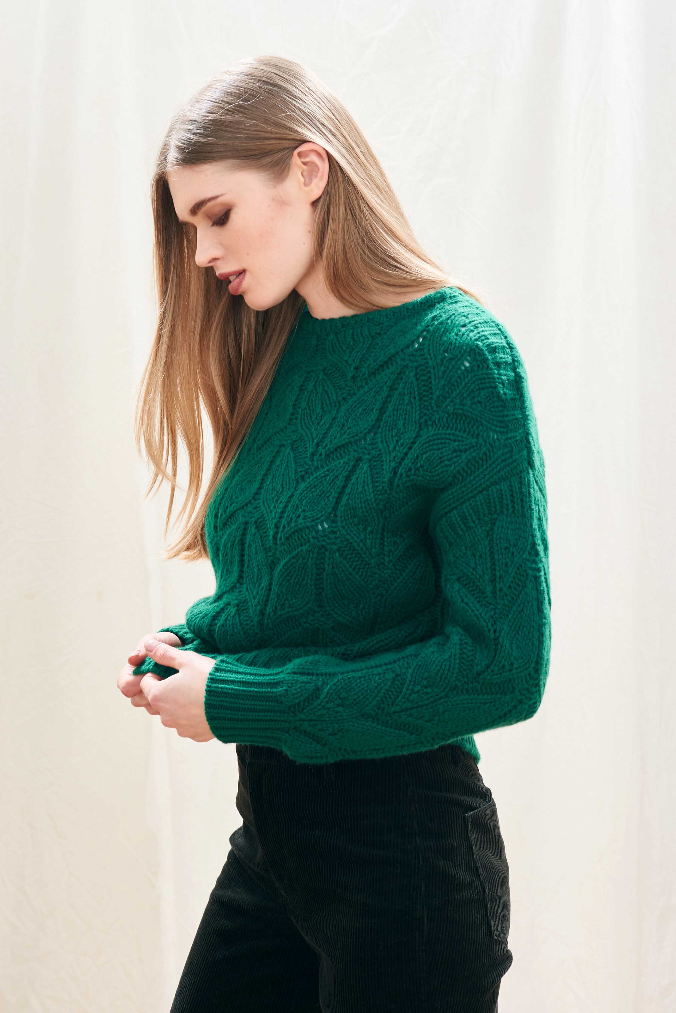 Female model wearing Jumper1234 green heavy weight 'leaf' textured crew neck jumper in cashmere wool