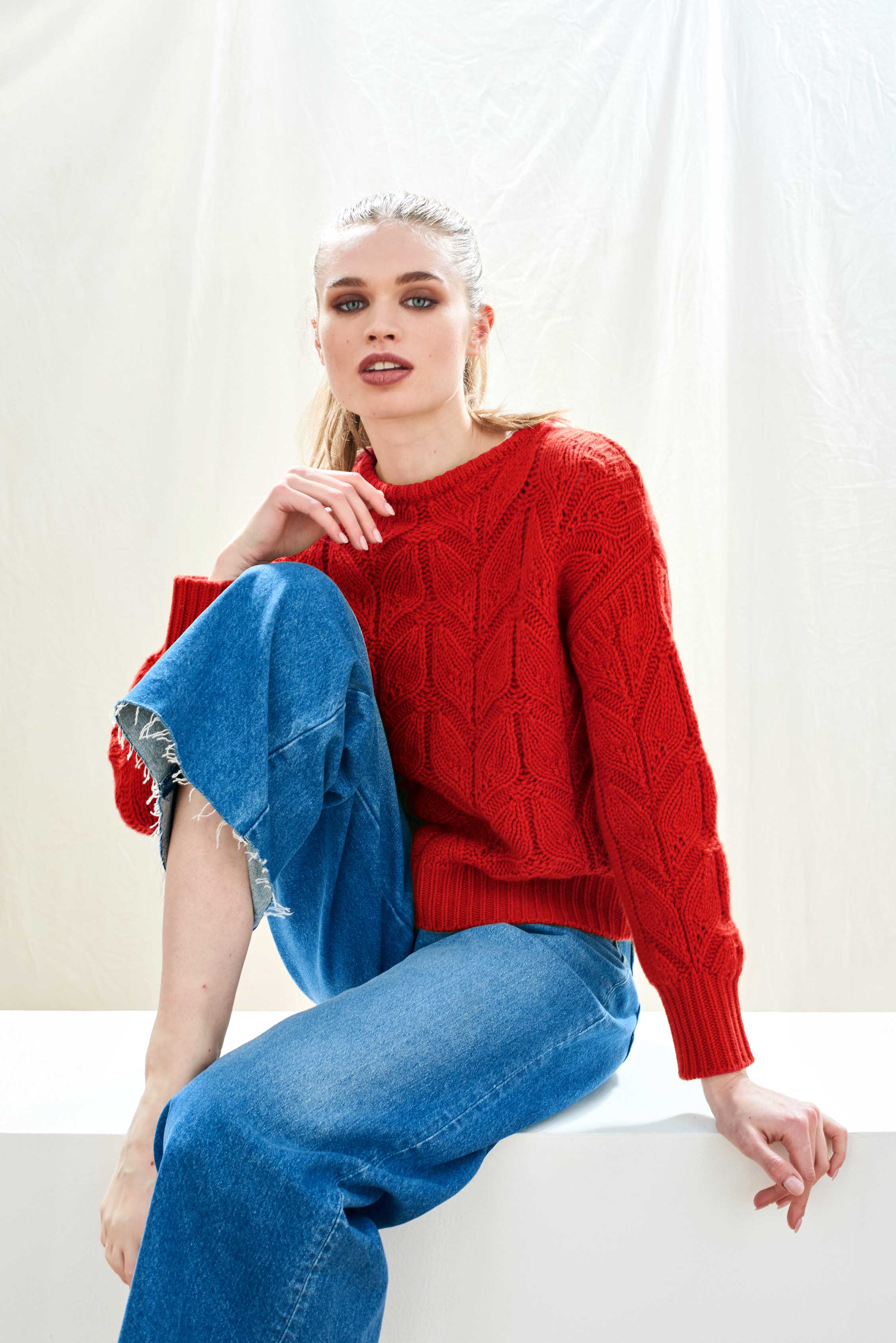 Female model wearing Jumper1234 red heavy weight 'leaf' textured crew neck jumper in cashmere wool