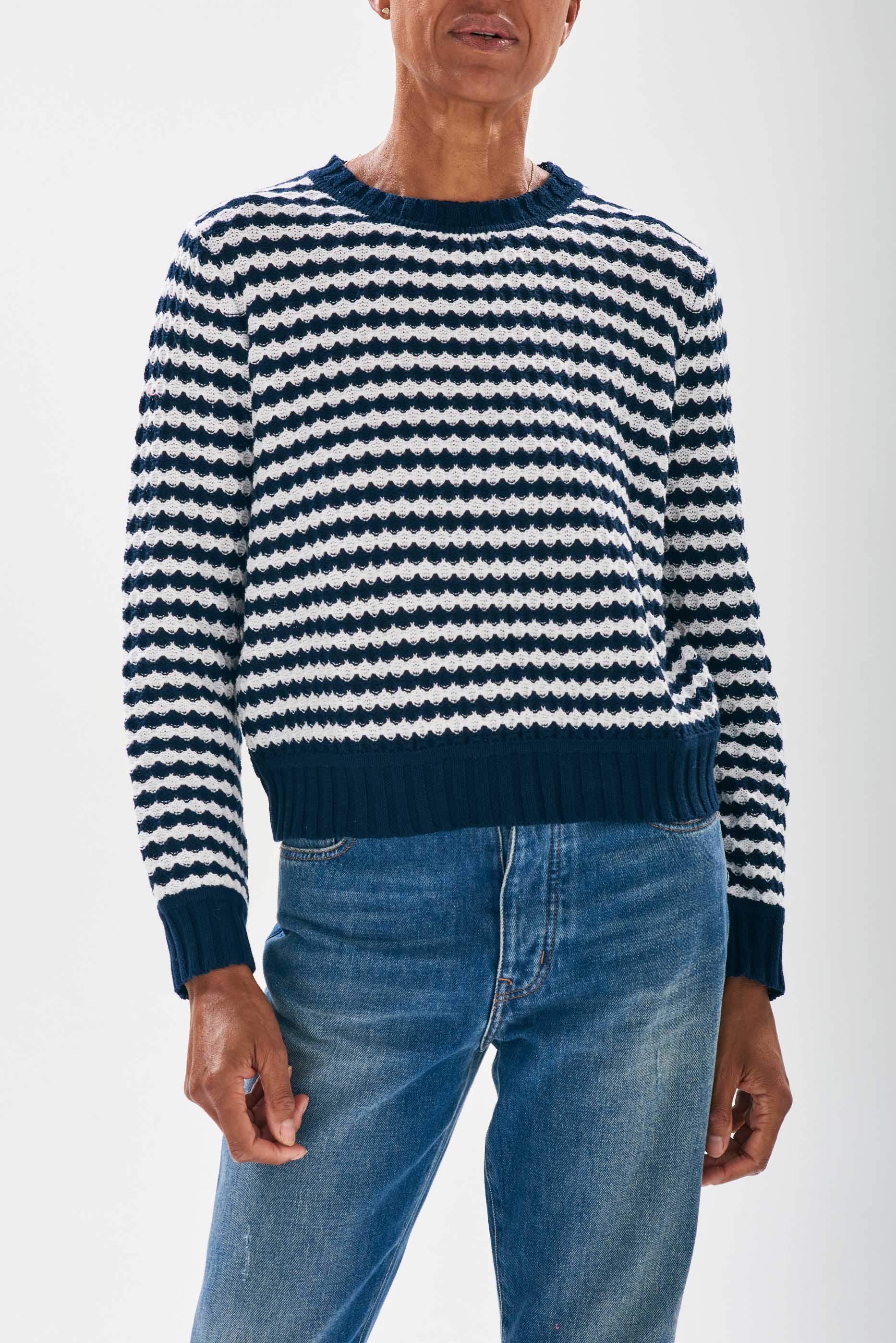 Model wearing Jumper1234 Ripple effect stripe cotton crew neck in navy and white
