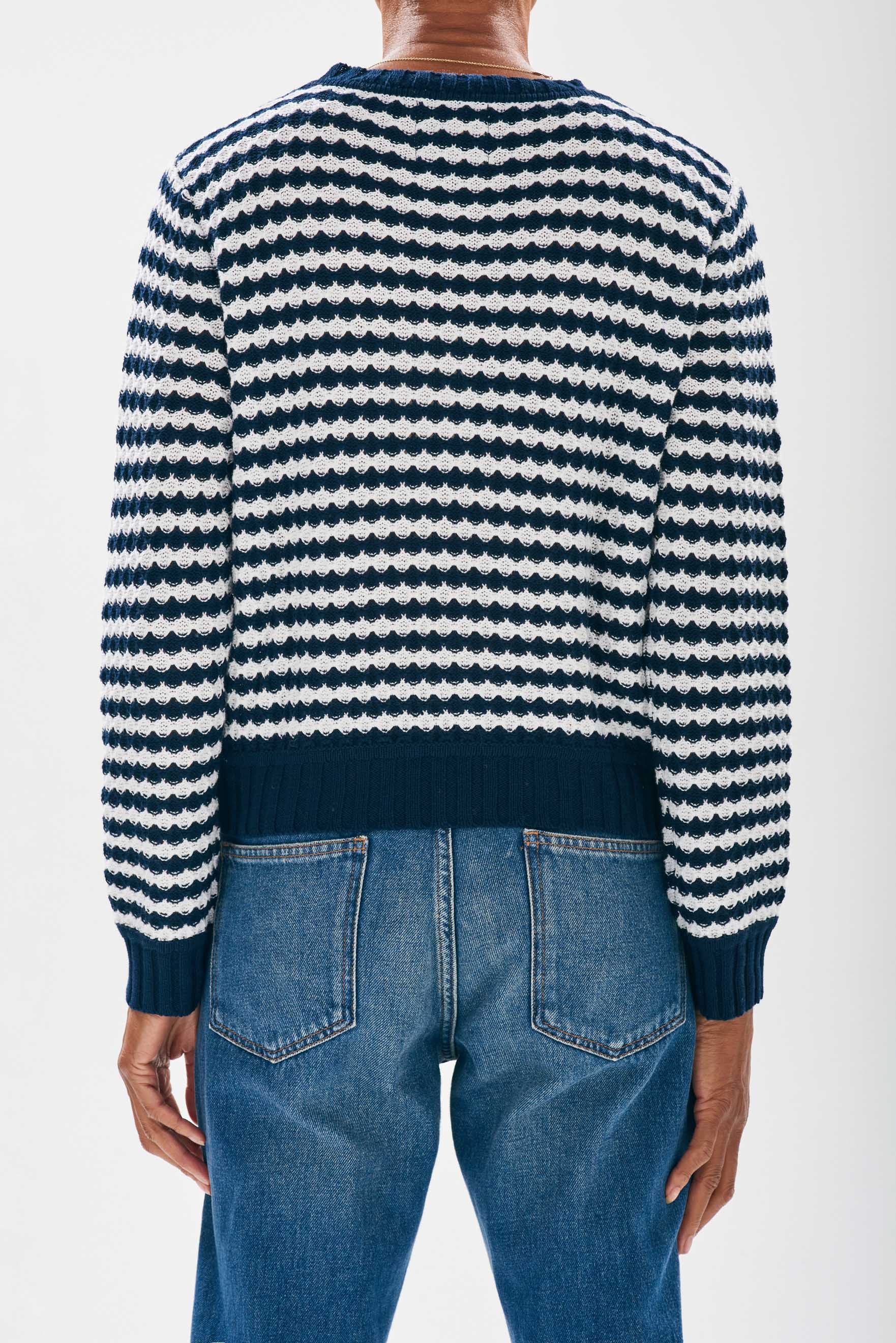Model wearing Jumper1234 Ripple effect stripe cotton crew neck in navy facing away from the camera