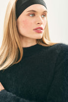 Female model wearing Jumper1234 Cashmere Brushed Turtle in Black close up
