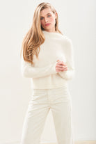Female model wearing Jumper1234 Cashmere Brushed Turtle in Cream
