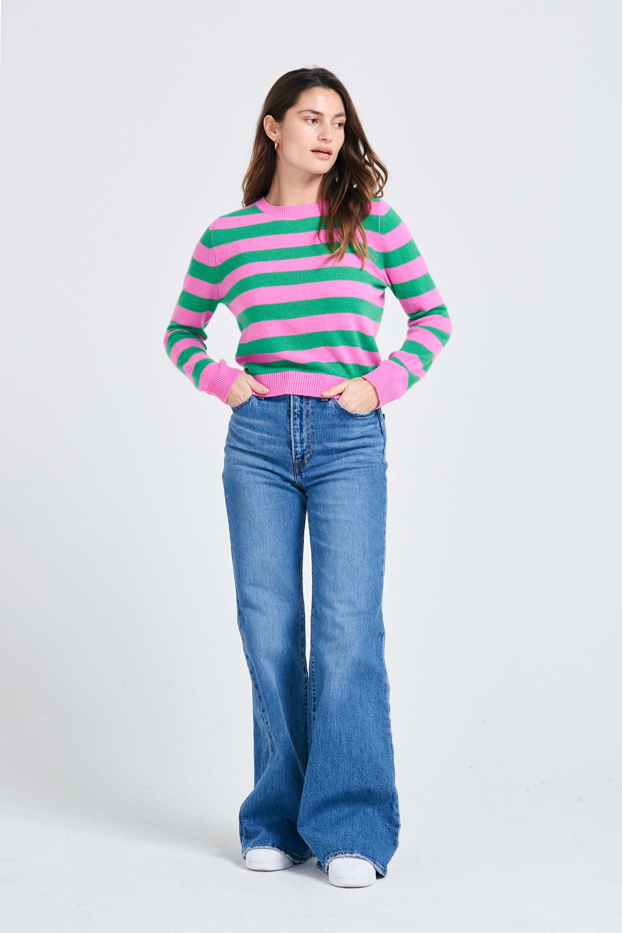 Brown haired female model wearing Jumper1234 Stripe cashmere crew neck jumper in peony and bright green