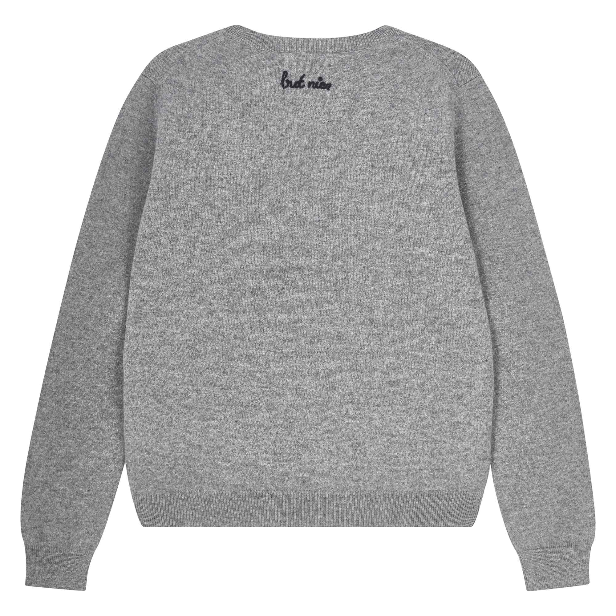 Jumper 1234 Mid grey cashmere crew neck jumper with navy 'naughty' chain stitch embroidery on the chest and 'but nice' on the back. Back shot
