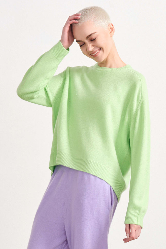 Blonde female model wearing Jumper1234 oversized cashmere crew in Lime Green