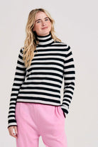 Blonde female model wearing Jumper1234 little stripe cashmere roll collar in black and marble with pecan tipping