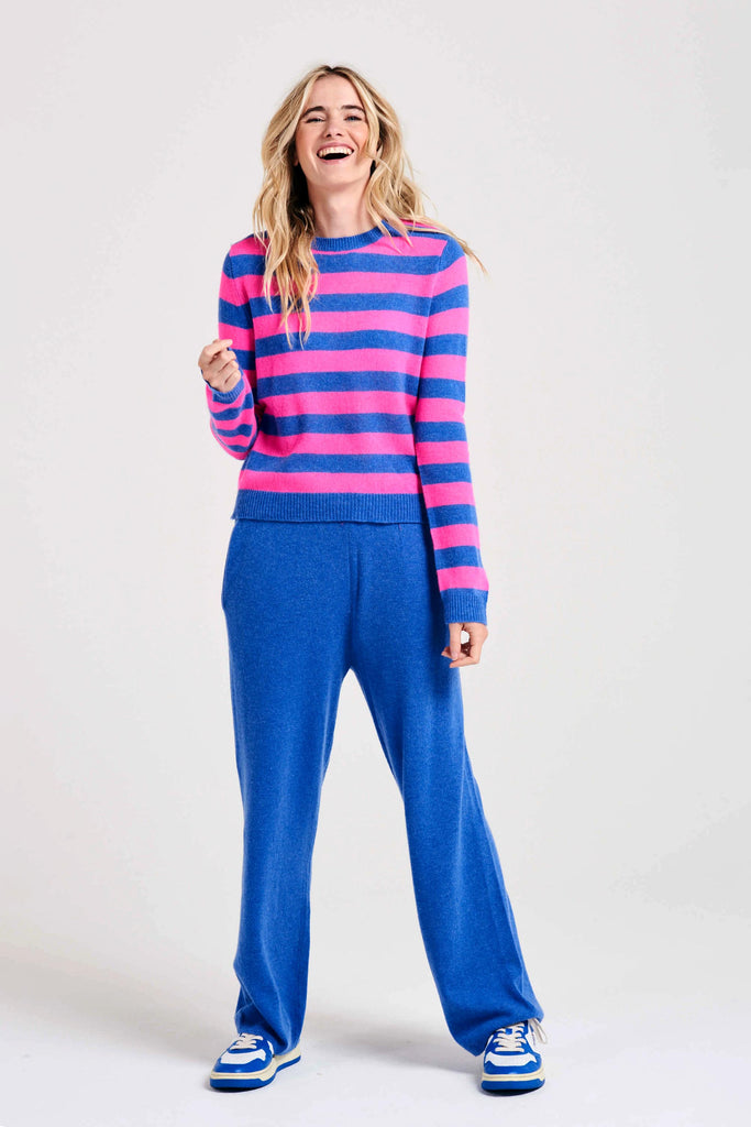 Blonde female model wearing Jumper1234 stripe cashmere crew in periwinkle and hot pink