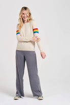 Blonde female model wearing Jumper1234 Rainbow arms cashmere crew in oatmeal