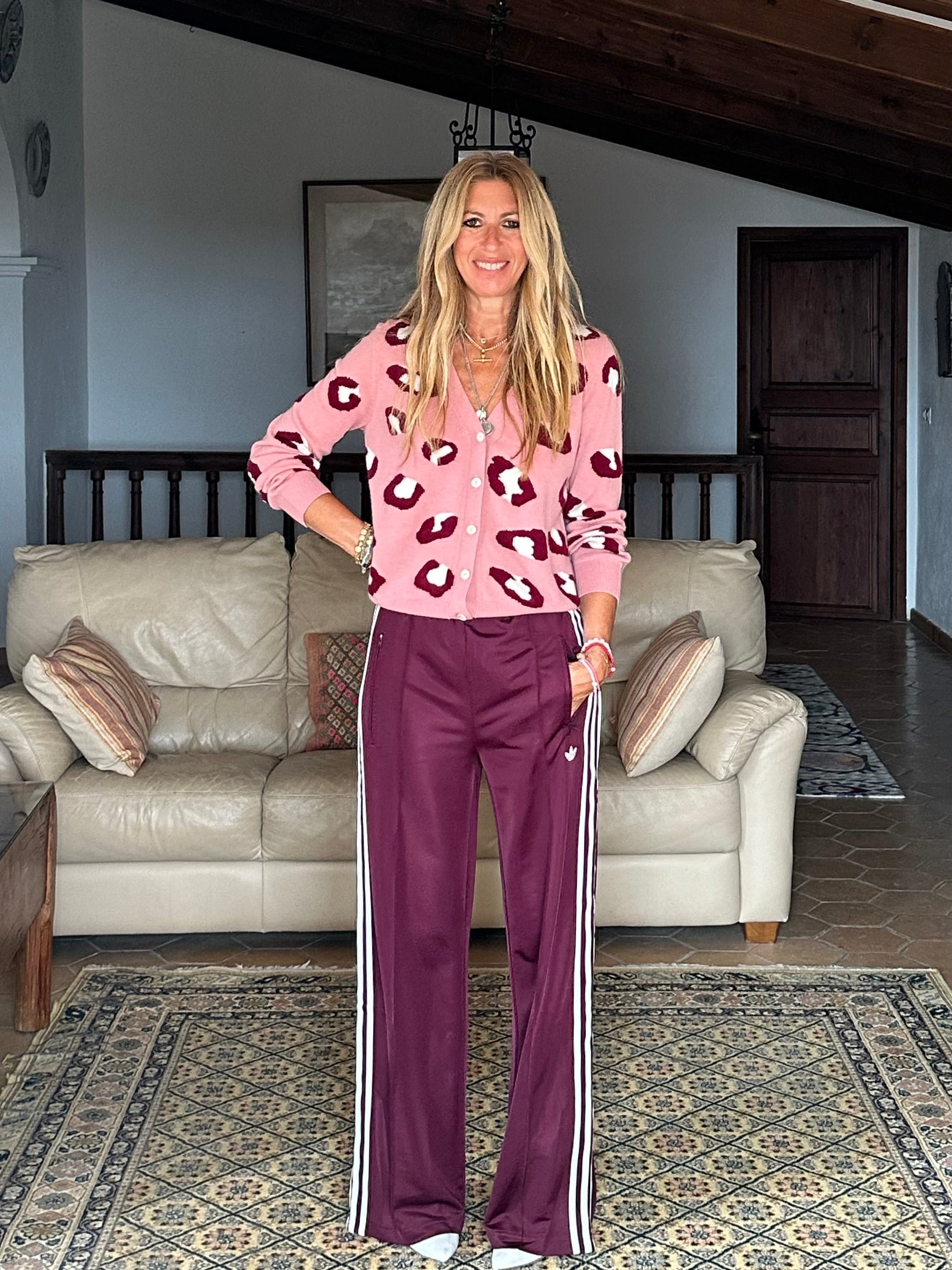 Gayle Rinkoff wearing Jumper1234 pink cashmere vee neck cardigan with burgundy and cream leopard intarsia