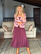 Gayle Rinkoff wearing Jumper1234 pink cashmere vee neck cardigan with burgundy and cream leopard intarsia