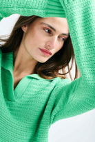Brown haired female model wearing Jumper1234 Apple green cotton jumper with a collar in a fabulous all over herringbone stitch