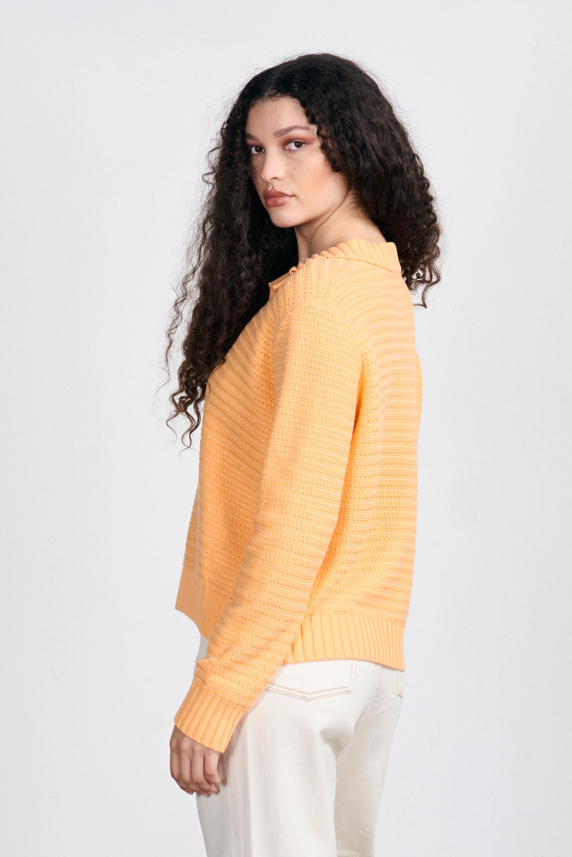 Brown haired female model wearing Jumper1234 Apricot cotton jumper with a collar in a fabulous all over herringbone stitch facing away from the camera