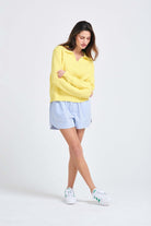 Brown haired female model wearing Yellow cotton jumper with a collar in a fabulous all over herringbone stitch