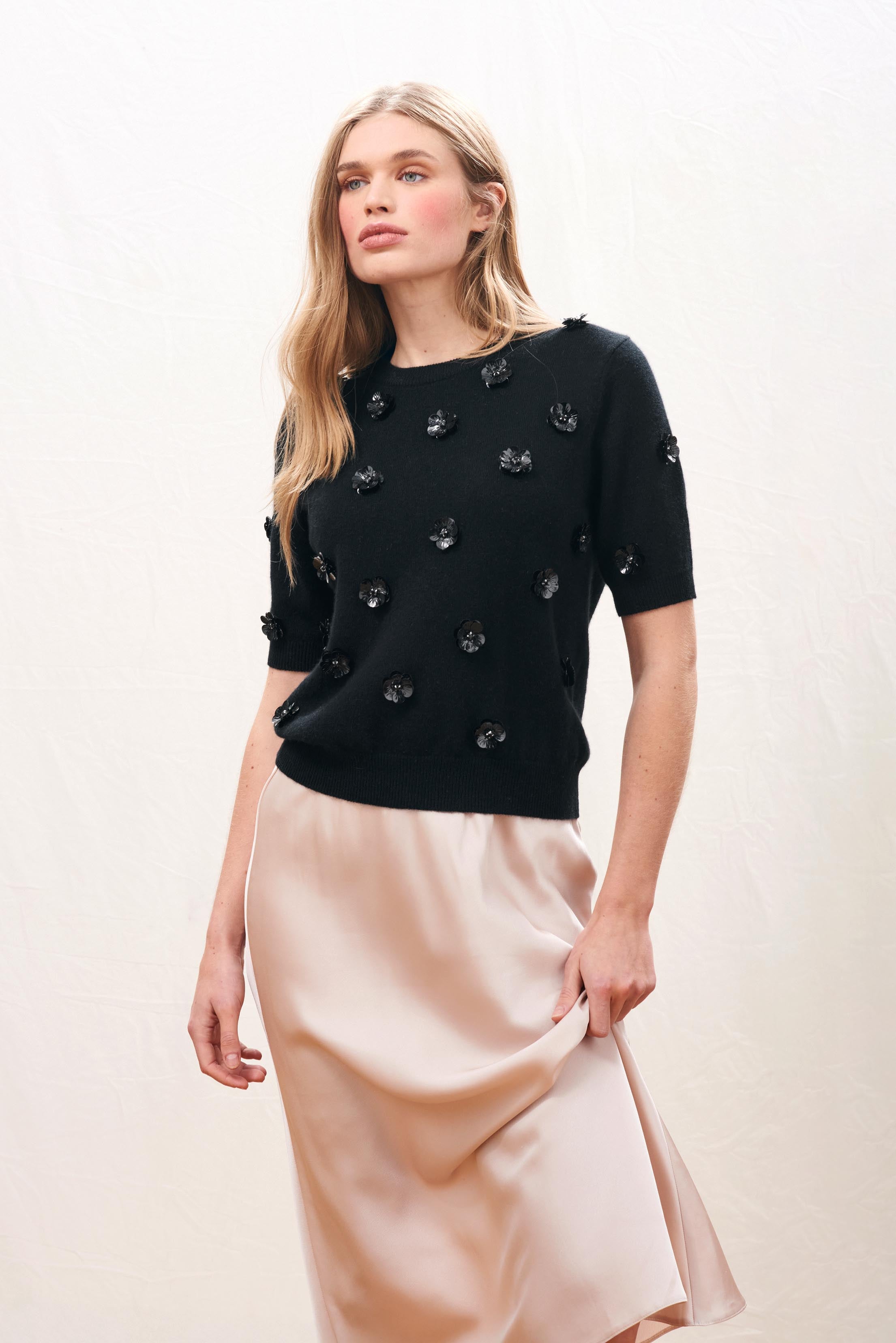 Female model wearing Jumper 1234 black short sleeve true to size cashmere jumper with sequin flowers 