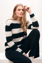 Female model wearing Jumper 1234 stone and black 'broken' stripe crew neck cashmere jumper slightly cropped fit