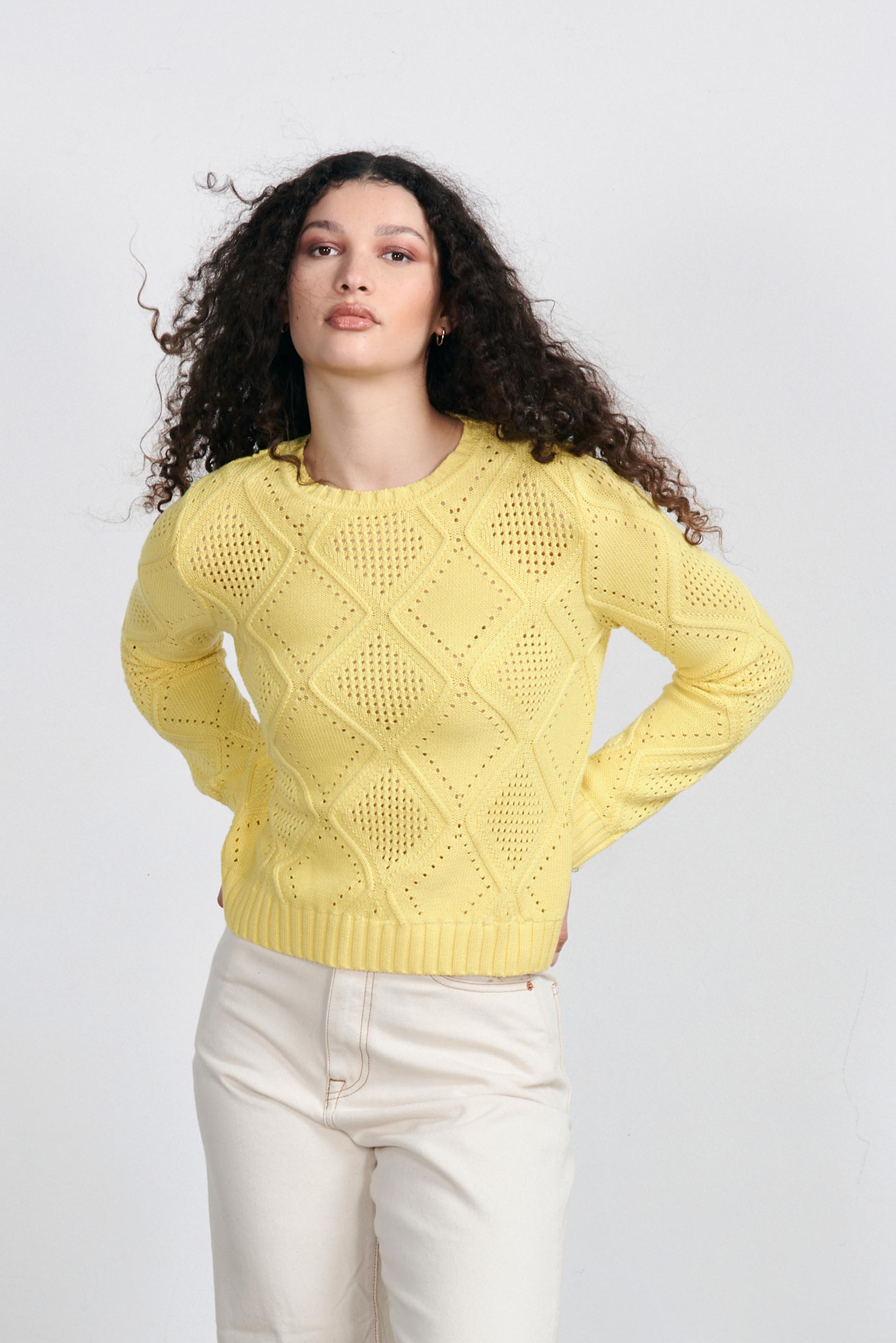 Brown haired female model wearing Jumper1234 Yellow cotton crew neck jumper with a diamond texture stitch pattern