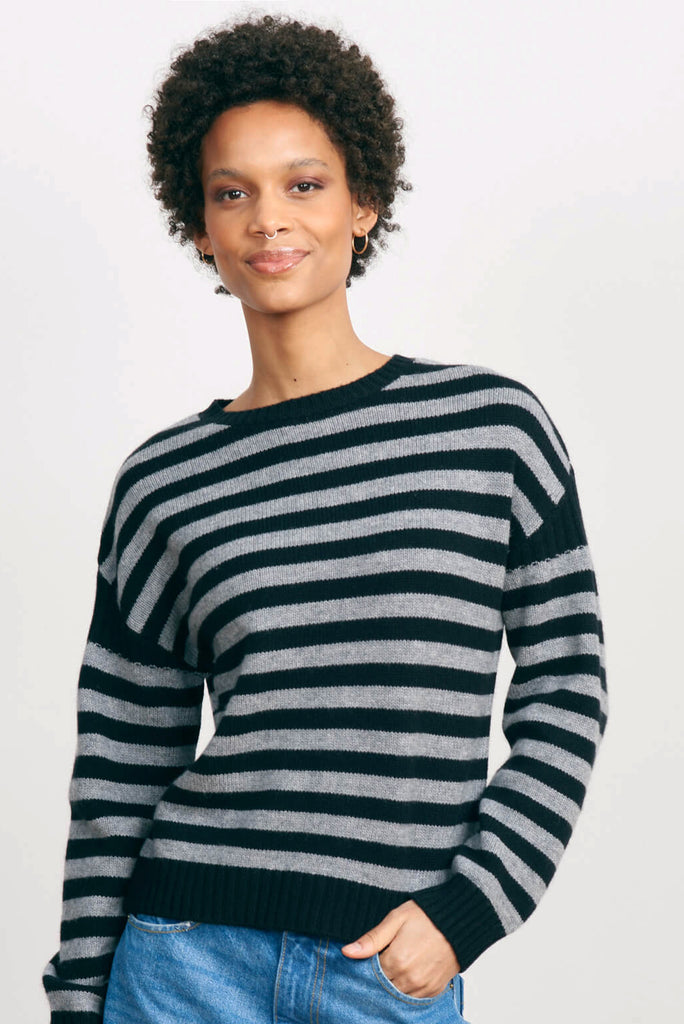 Brown haired female model wearing Jumper 1234 black and mid grey stripe cashmere and wool Guernsey