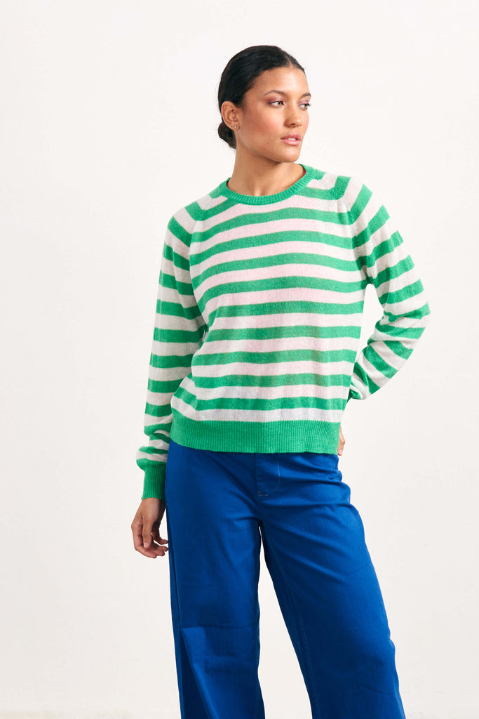 Brown haired female model wearing Jumper1234 bright green and pale pink lightweight merino "Stripe crew" 