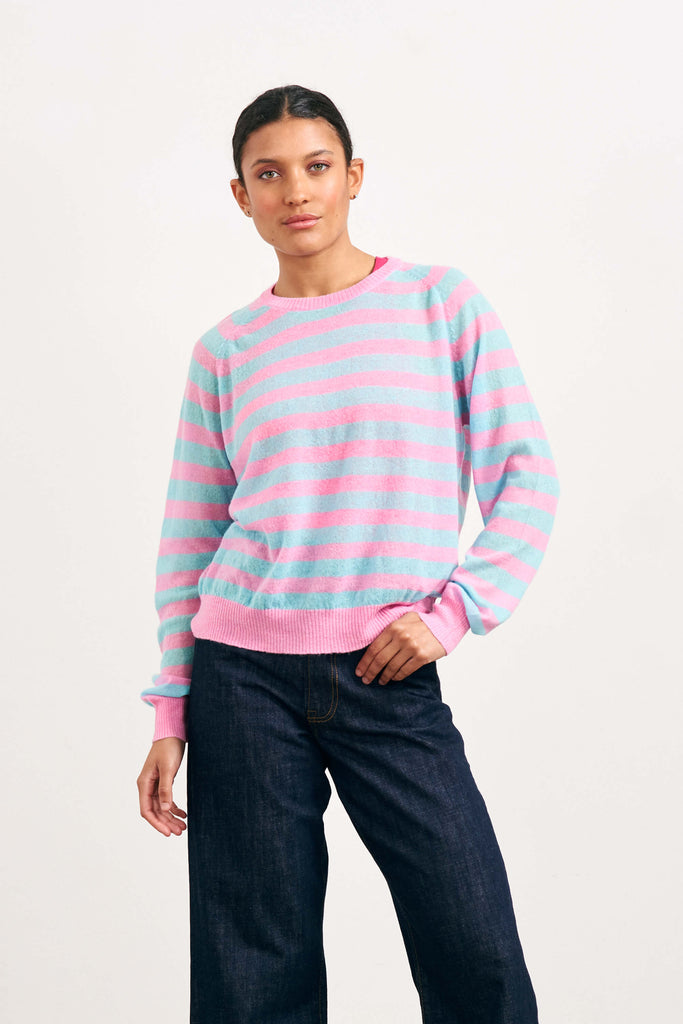 Brown haired female model wearing Jumper1234 bright pink and turquoise lightweight merino "Stripe crew" 