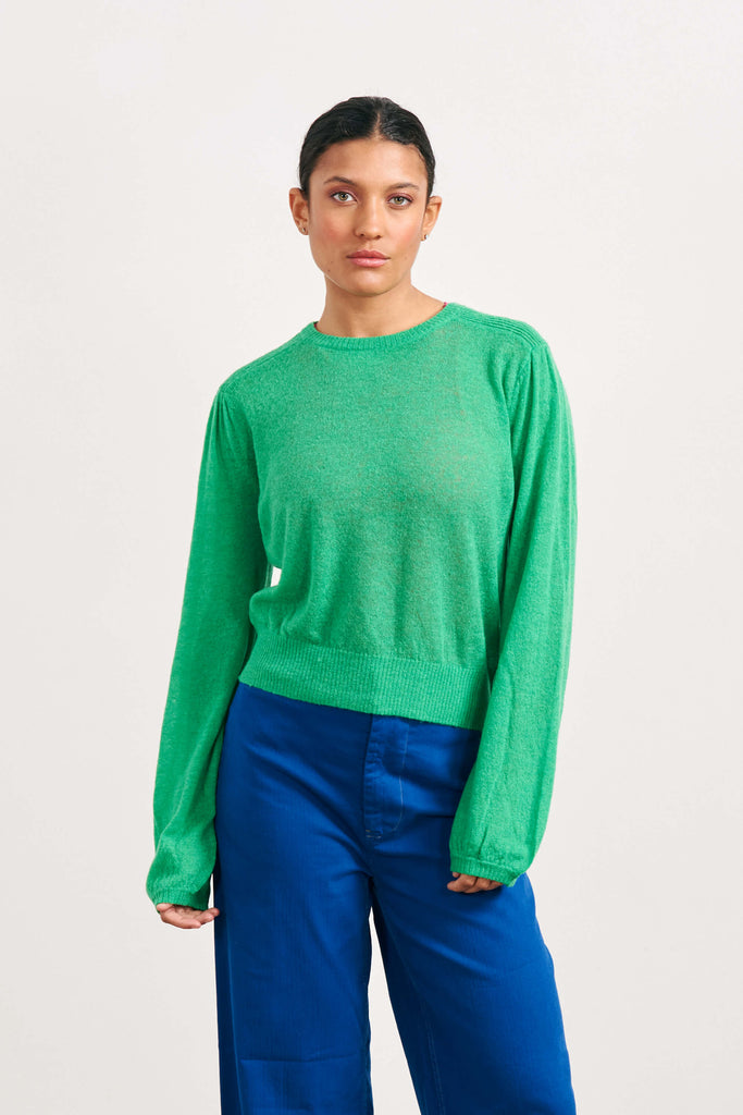 Brown haired female model wearing Jumper1234 bright green lightweight merino "Balloon Sleeve crew" 