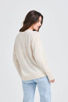 Jumper1234 Oversize cashmere vee neck cardigan in oatmeal facing away from the camera