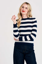 Blonde female model wearing Jumper1234 Stripe cashmere crew neck jumper in navy and cream