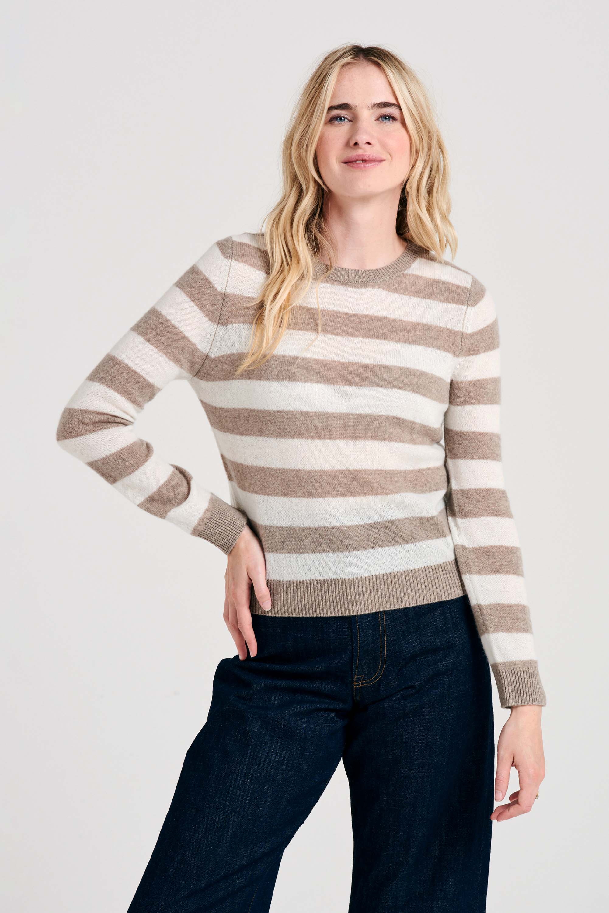 Blonde female model wearing Jumper1234 Stripe cashmere crew neck jumper in organic light brown and cream