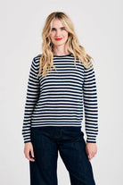 Blonde female model wearing Jumper1234 Little stripe cashmere crew neck jumper in navy and cream