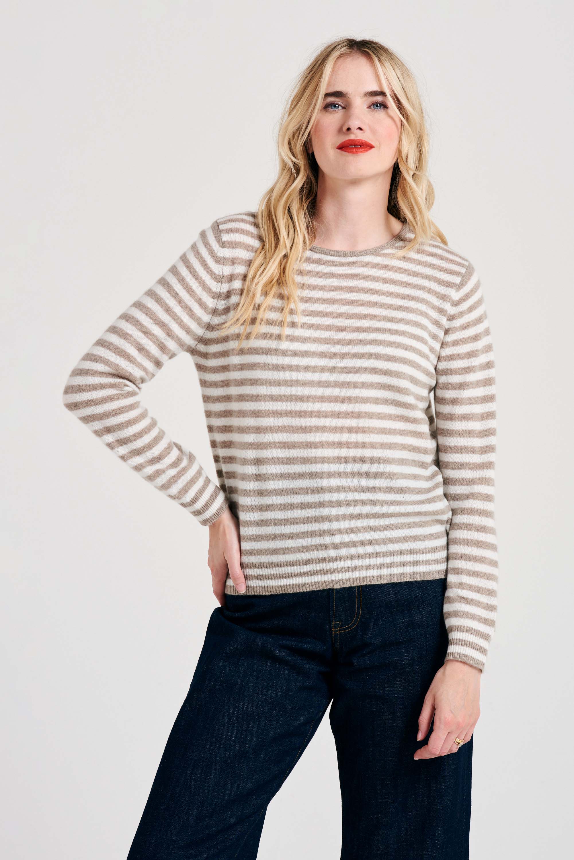 Blonde female model wearing Jumper1234 Little stripe cashmere crew neck jumper in organic light brown and cream