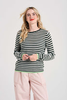 Blonde female model wearing Jumper1234 Little stripe cashmere crew neck jumper in khaki and cream, with lime green tipped ribs