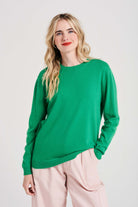 Blonde female model wearing Jumper1234 Boyfriend fit cashmere crew neck jumper in bright green