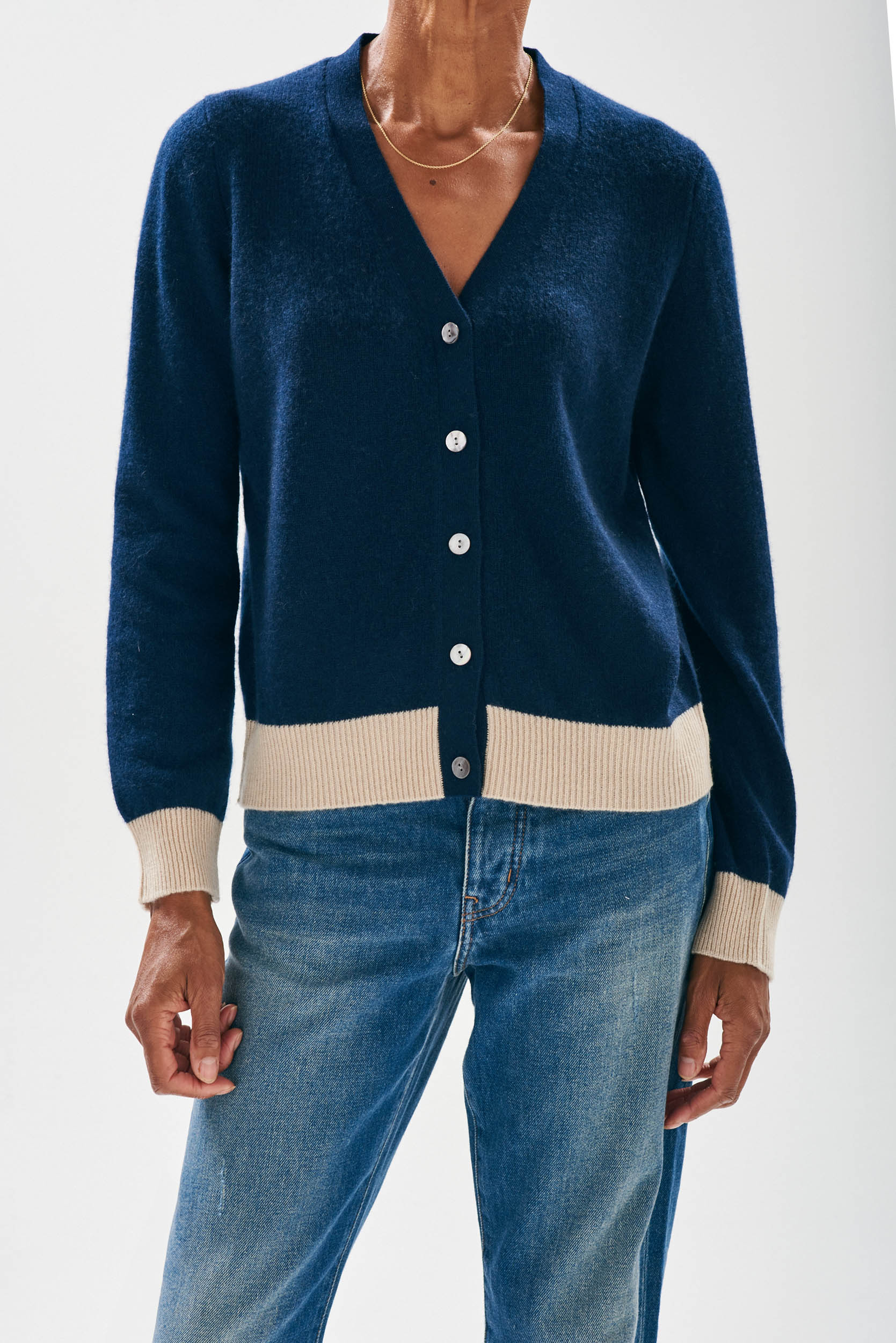 Model wearing Jumper1234 Navy vee neck cardigan with contrast organic light brown ribs