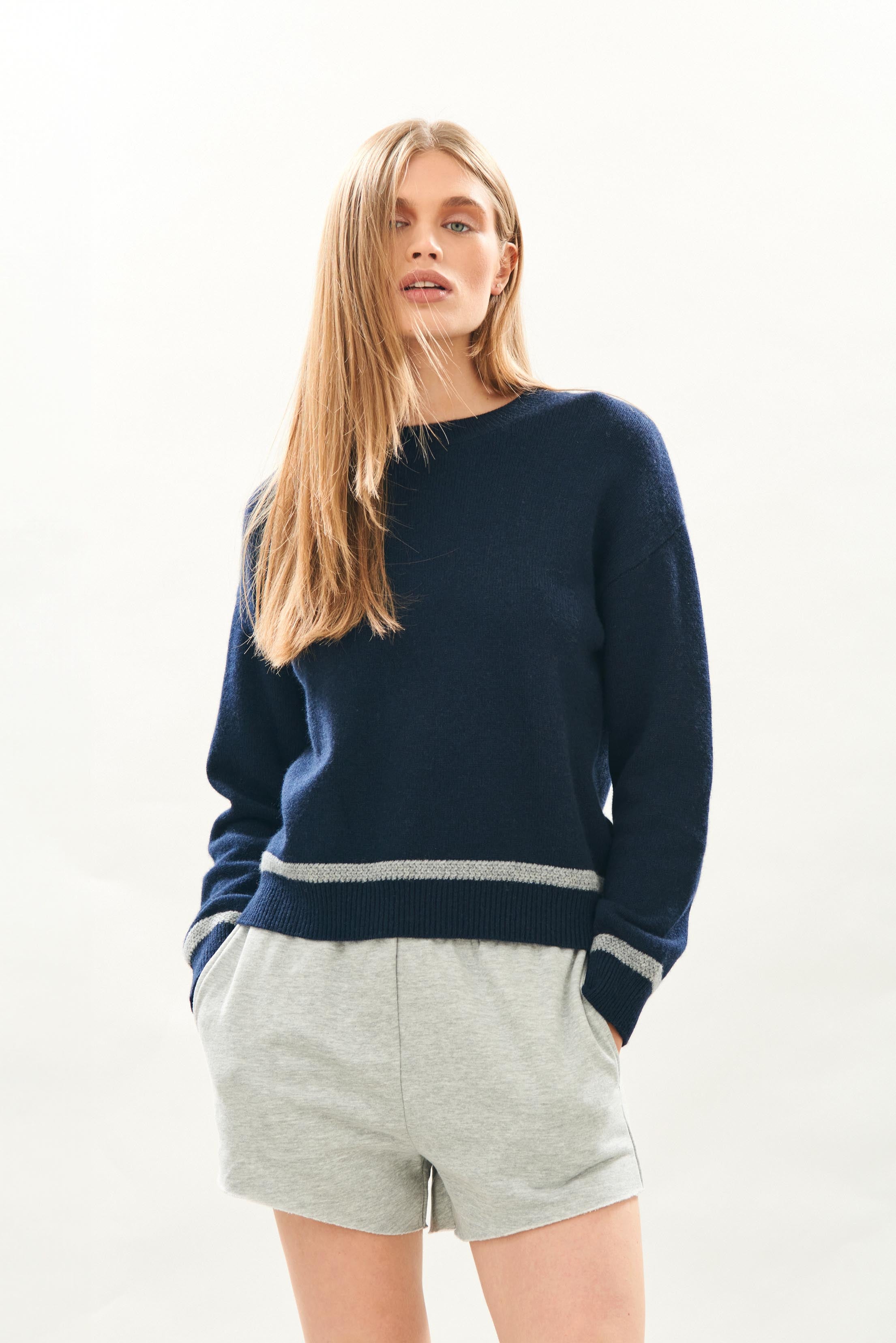 female model wearing jumper1234 Cashmere Wool Heavy Trim Crew in Navy and Grey facing towards the camera 