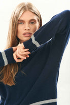 female model wearing jumper1234 Cashmere Wool Heavy Trim Crew in Navy and Grey facing towards the camera 