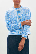 female model wearing jumper1234 Cashmere Wool Norse Cardigan in Cream and Sky close up 