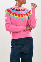 Female model wearing Jumper1234 Cashmere Rick Rack yolk Crew in Pink close up 