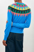 Female model wearing Jumper1234 Cashmere Rick Rack yolk Crew in Sky blue facing away from the camera