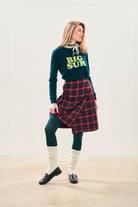 Model wearing Jumper1234 Bottle green cashmere crew neck with acid green 'Big Sur' intarsia