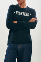 Female model wearing Jumper1234 Cashmere Wanted Crew in Black and Cream
