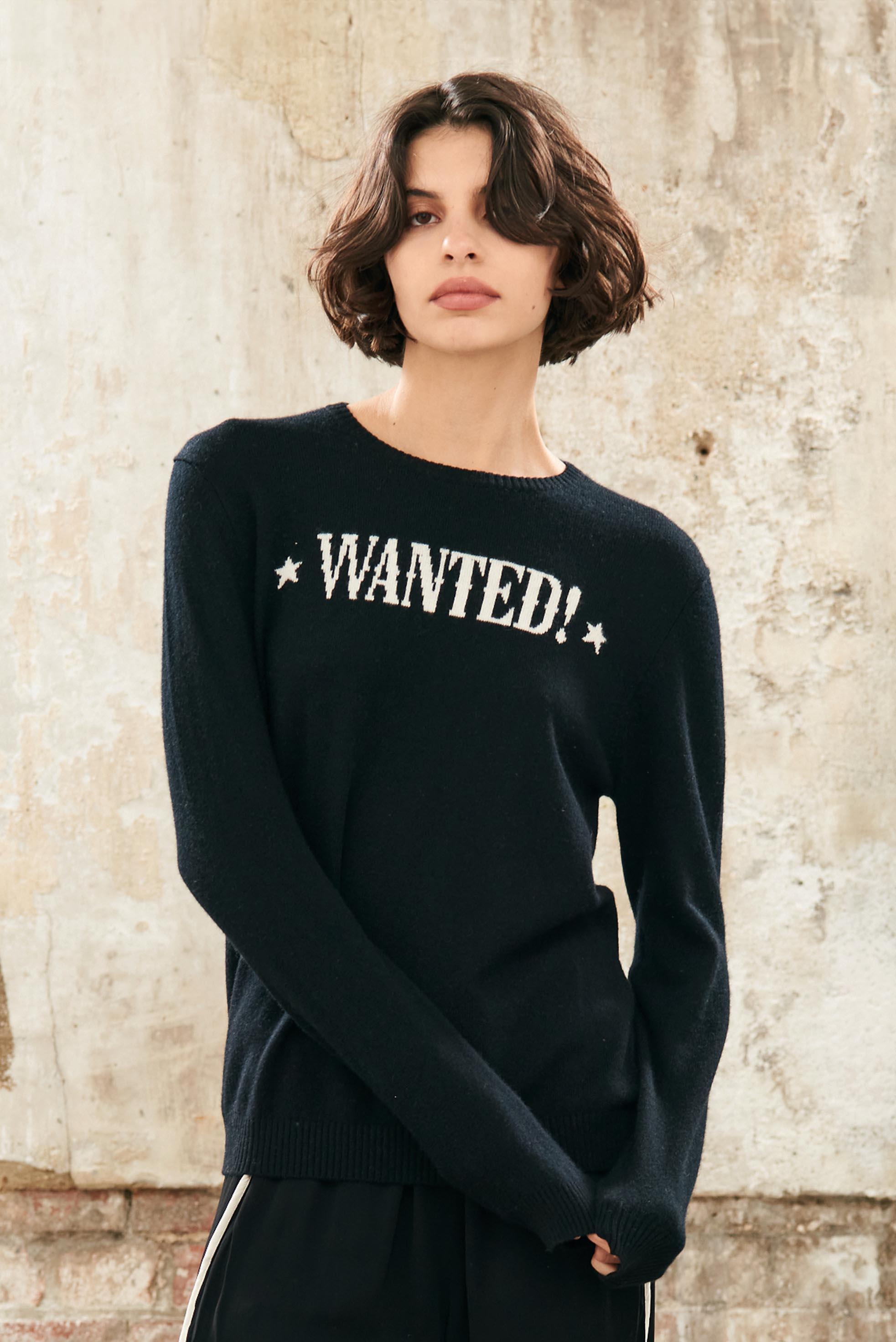 Female model wearing Jumper1234 Cashmere Wanted Crew in Black and Cream