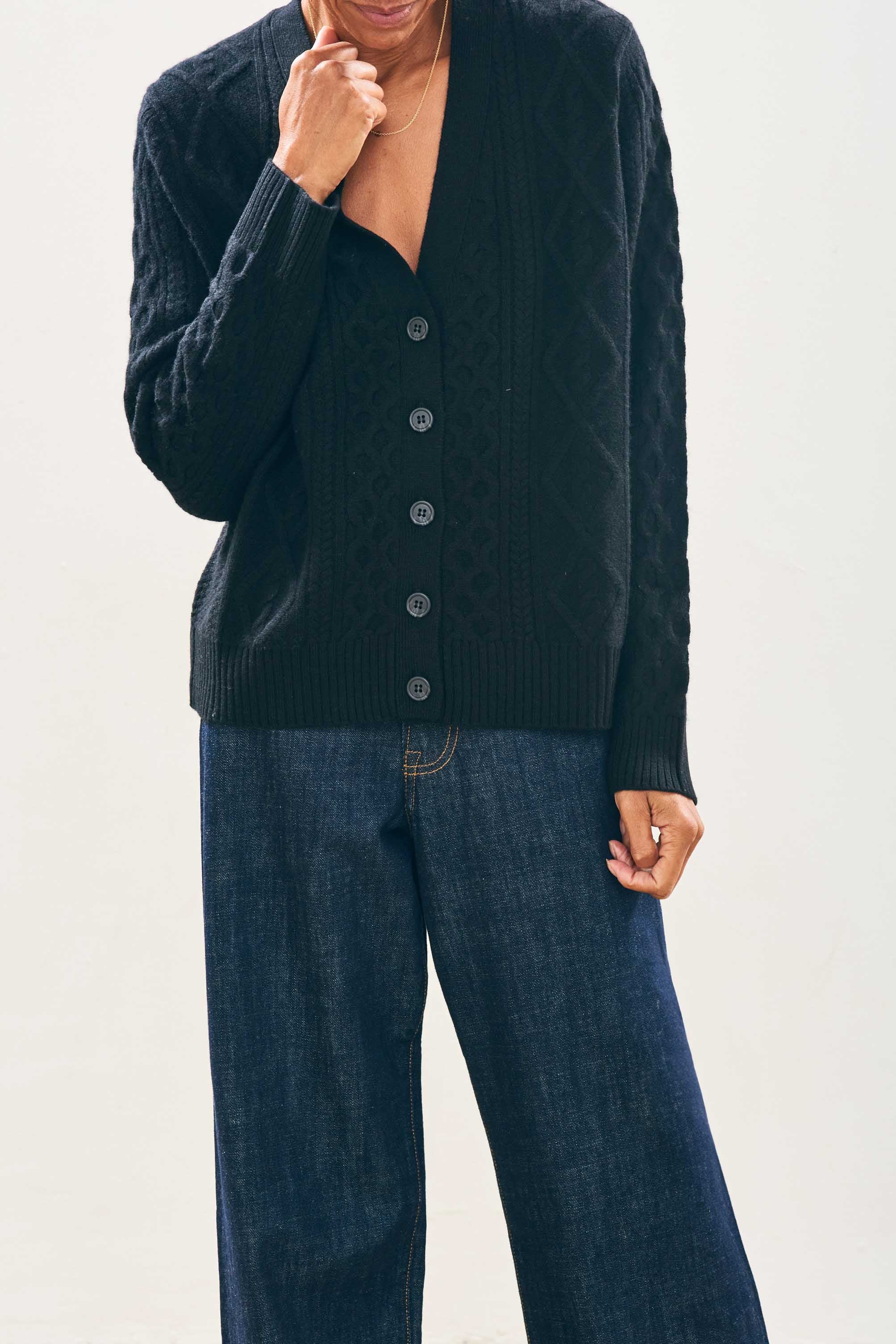 Model wearing Jumper1234 Cashmere Wool Aran Cardigan in Black