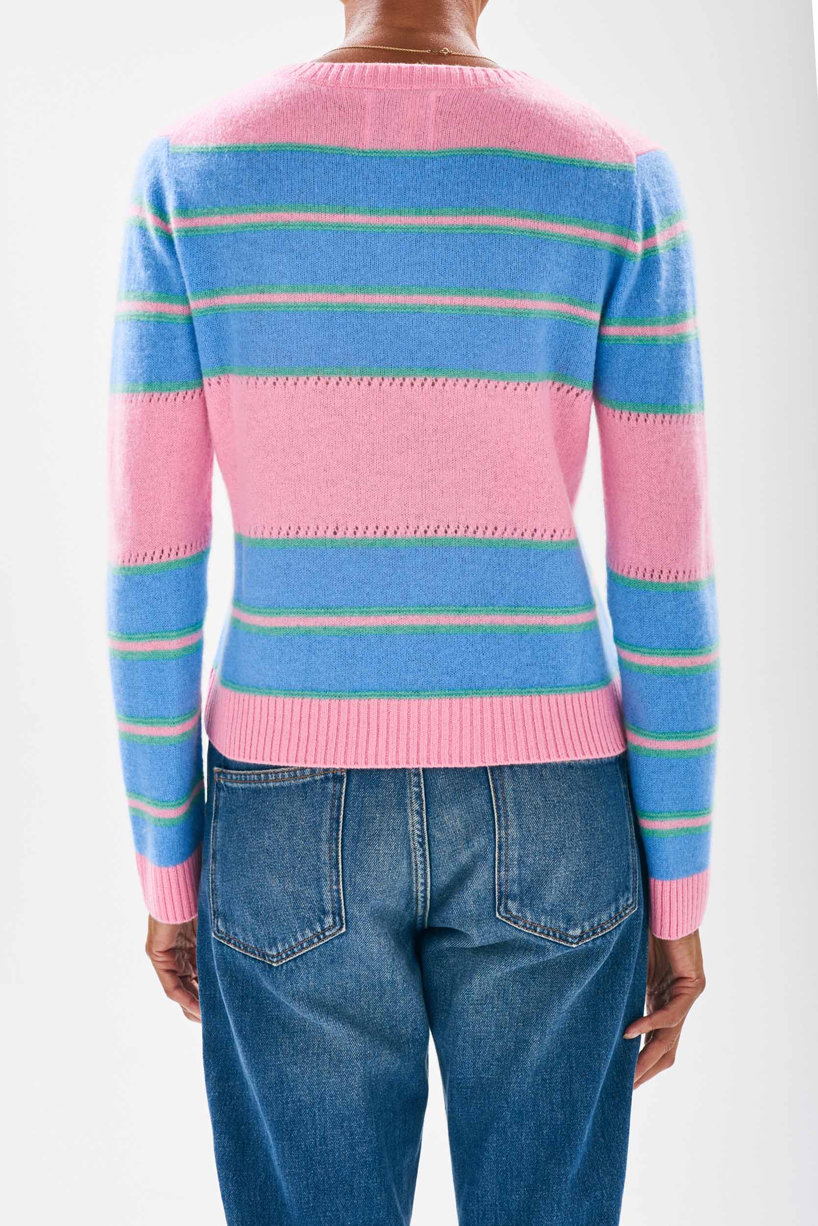 Model wearing Jumper 1234 cashmere candy and sky blue stripe crew neck cashmere jumper with textured 'hole' details and a little mint green stripes facing away from the camera