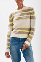 Model wearing Jumper 1234 cashmere oatmeal and organic light brown stripe crew neck cashmere jumper with textured 'hole' details and a little lemon stripes