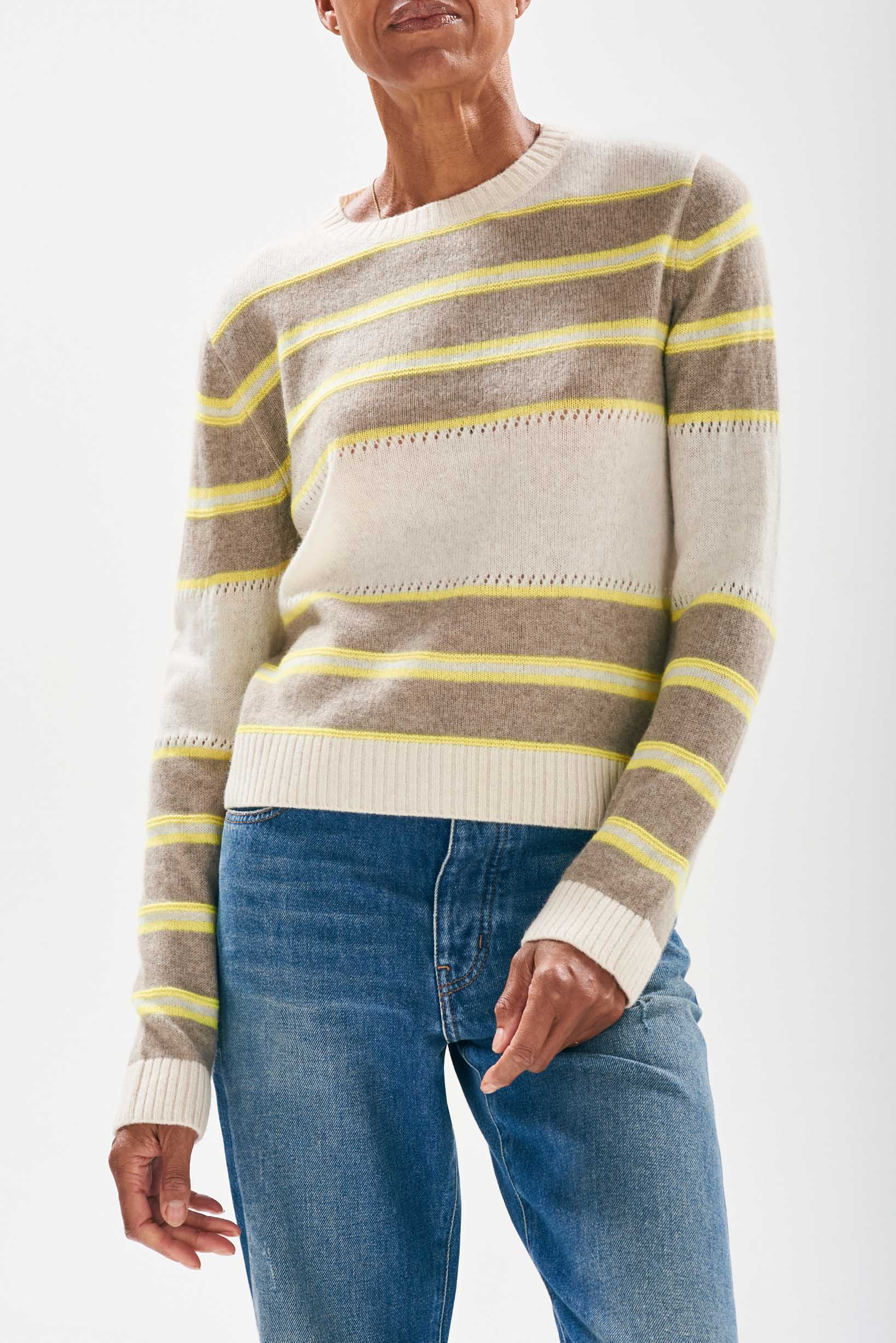 Model wearing Jumper 1234 cashmere oatmeal and organic light brown stripe crew neck cashmere jumper with textured 'hole' details and a little lemon stripes