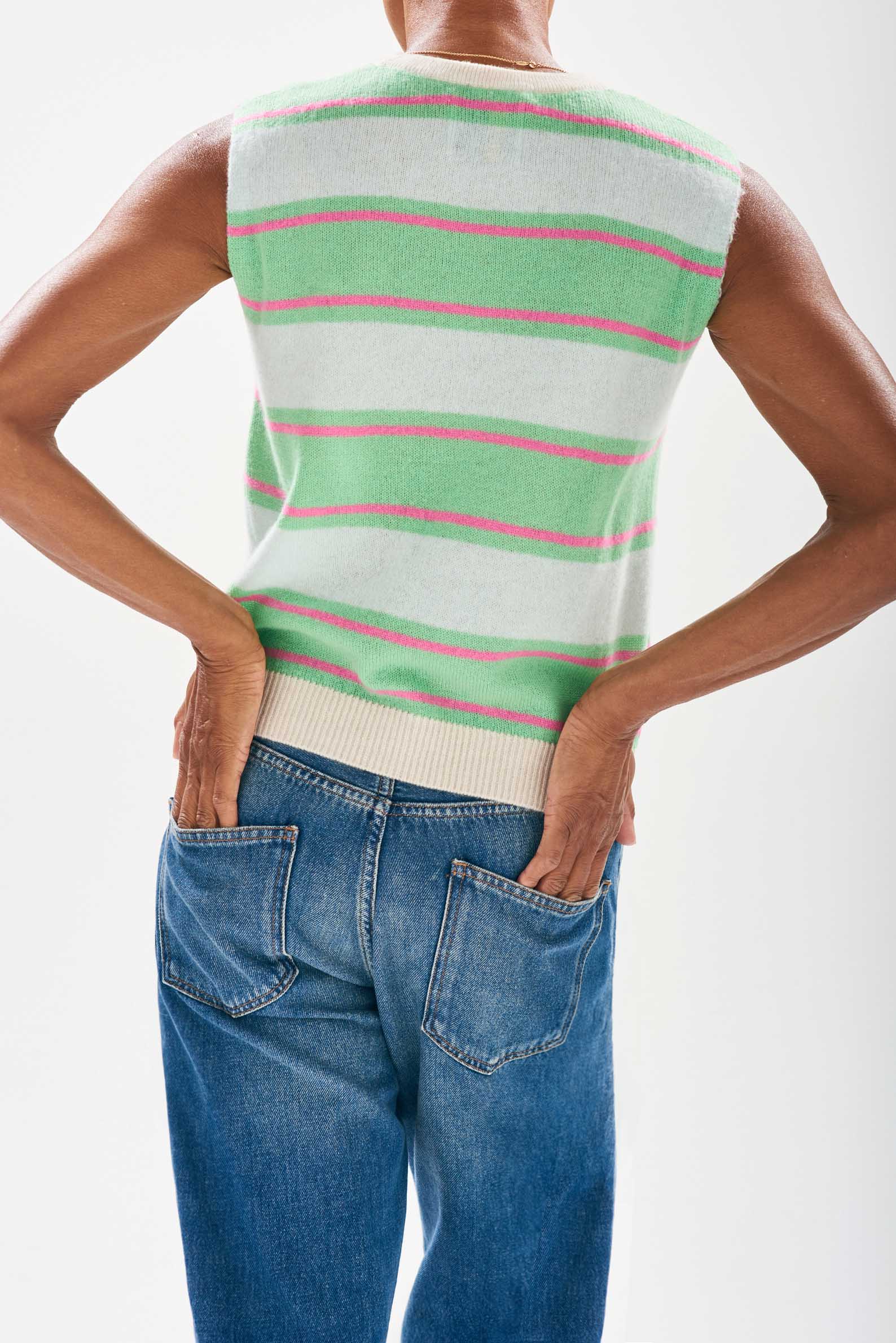 Model wearing Jumper1234 Deckchair stripe tank. Pale green and apple striped cashmere crew neck tank with oatmeal ribs and a narrow pink stripe too. Facing away from the camera