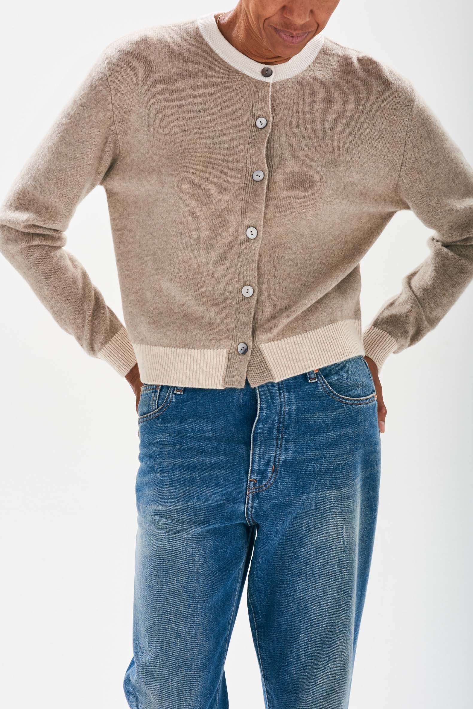 Model wearing Organic light brown cashmere cardigan with contrast ribs in oatmeal and cream