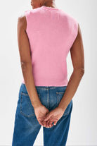 Model wearing Jumper1234 Candy pink cashmere crew neck tank with 'distressed' ribs facing away from the camera